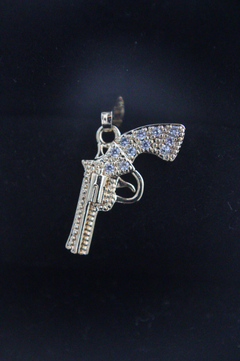 Dije revolver circones blancos